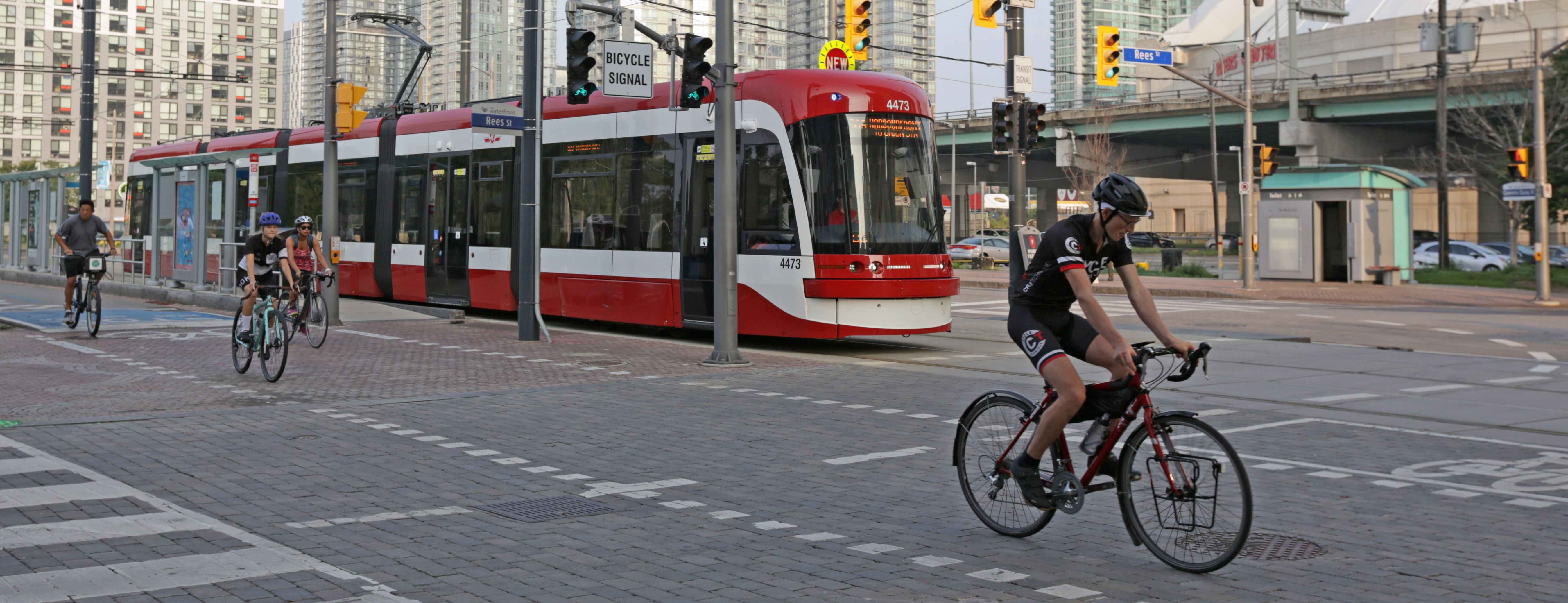 cyclist and streetcar in Toronto