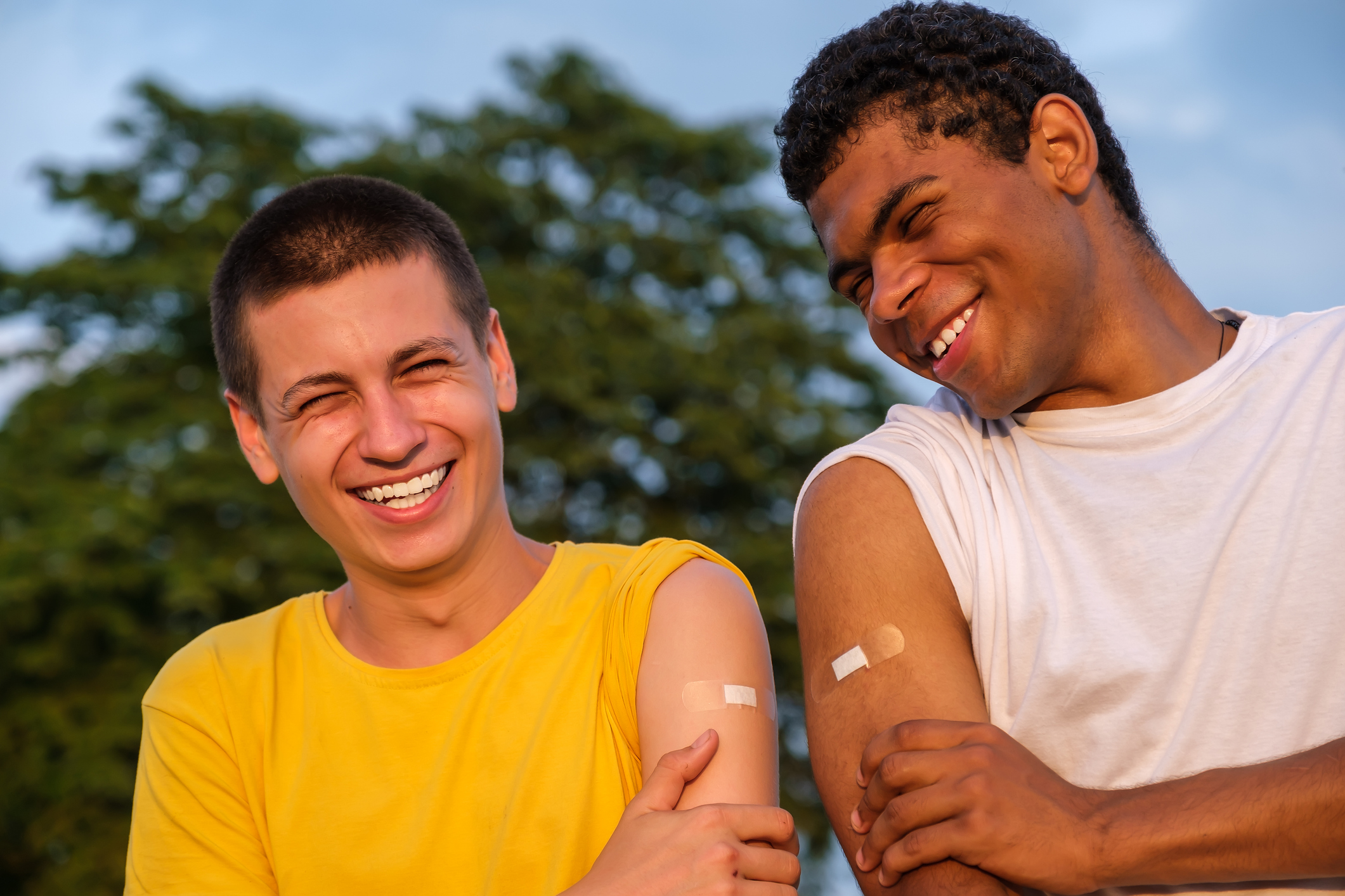 two young men vaccinated